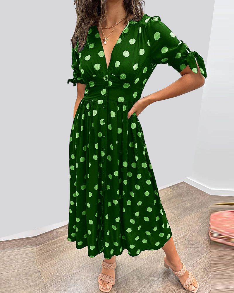 ANKA | Polka dot dress with flared hem and accentuated waist