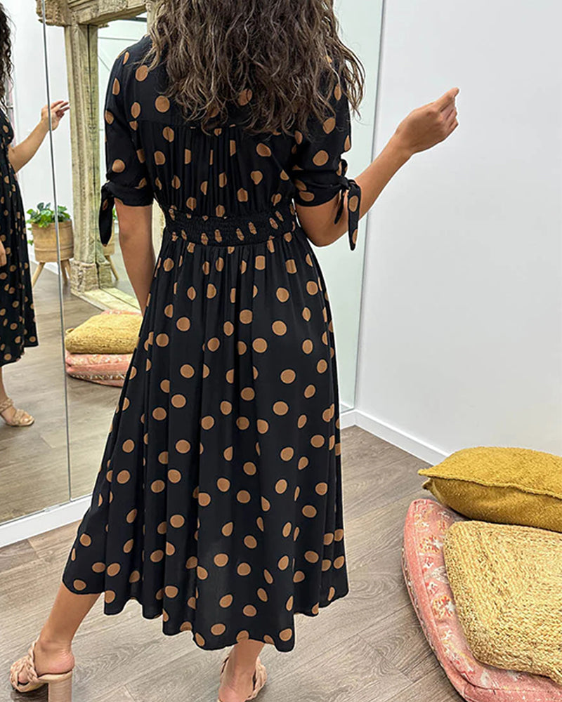 ANKA | Polka dot dress with flared hem and accentuated waist