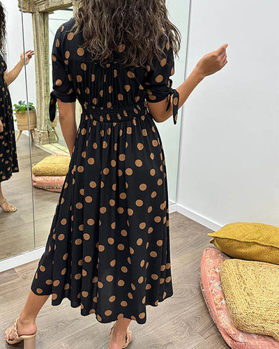 ANKA | Polka dot dress with flared hem and accentuated waist